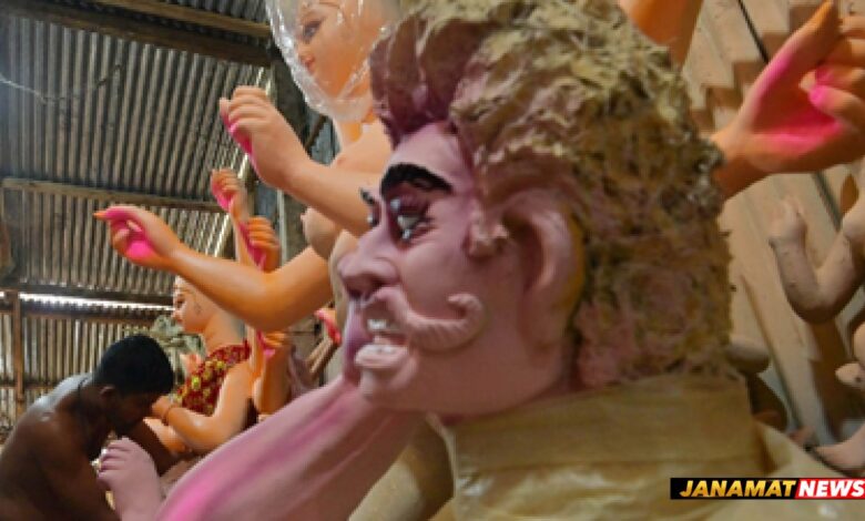 An idol maker gives the finishing touches to an idol of Goddess Durga at his studio in the Bypass area on the outskirts of Agartala ahead of the Durga Puja festival on October 3. |